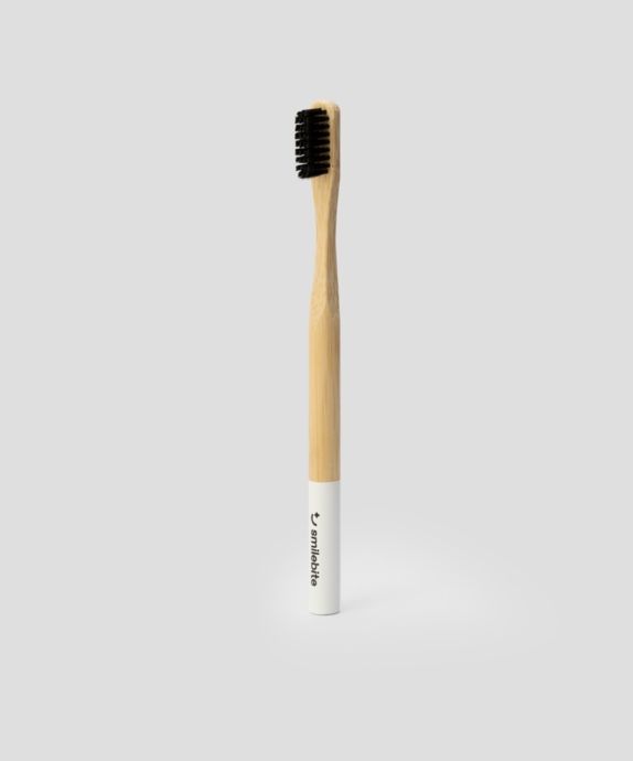 Smilebite bamboo toothbrush with black nylon bristles, suitable for vegans